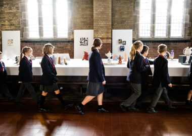 A line of schoolchildren walk past the Fresh exhibition at the 2023 Biennial.