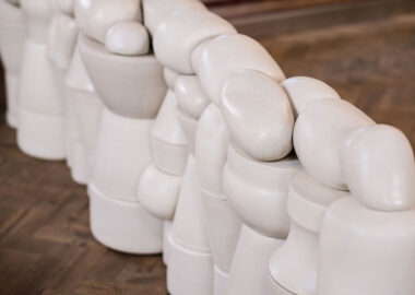 Sixty tightly stacked pots create Boundary End by Nicola Tassie, displayed at the British Ceramics Biennial 2023.