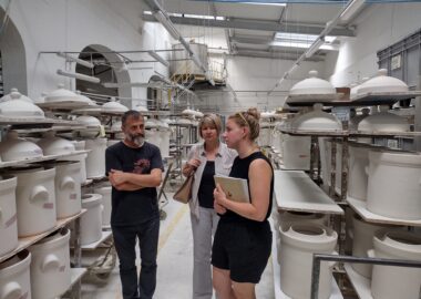 People talking in a ceramics factory as part of the Ceramic Cities Exchange.